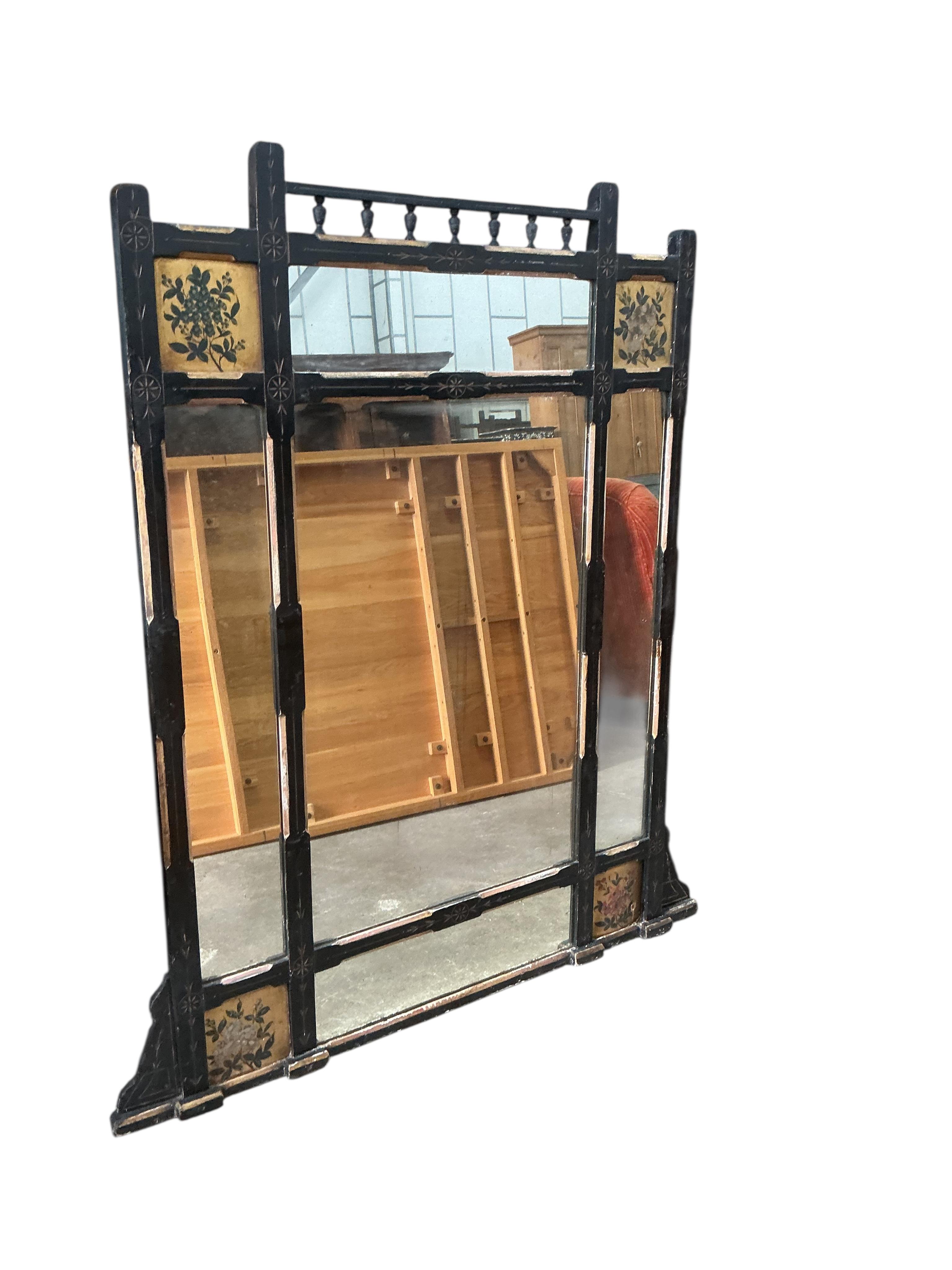 A late Victorian Aesthetic movement part ebonised painted overmantel mirror, width 94cm, height 134cm